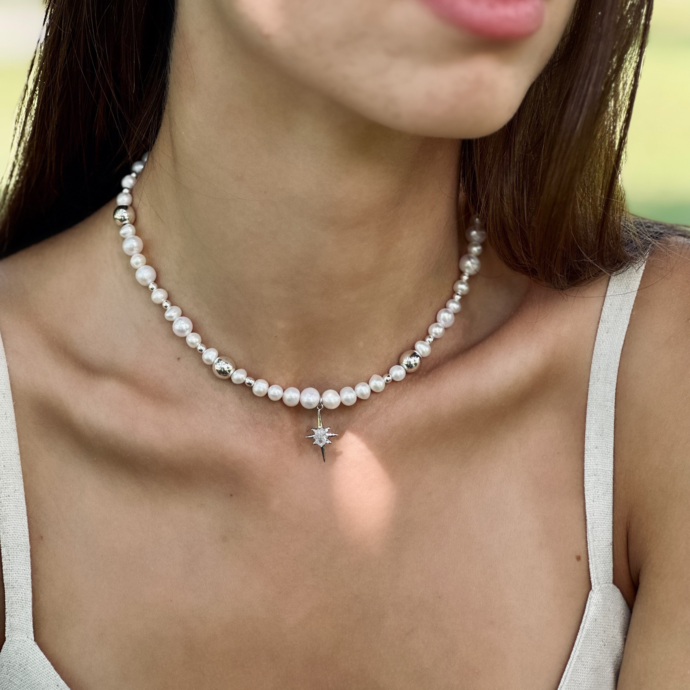 Necklace made of natural pearls with a star